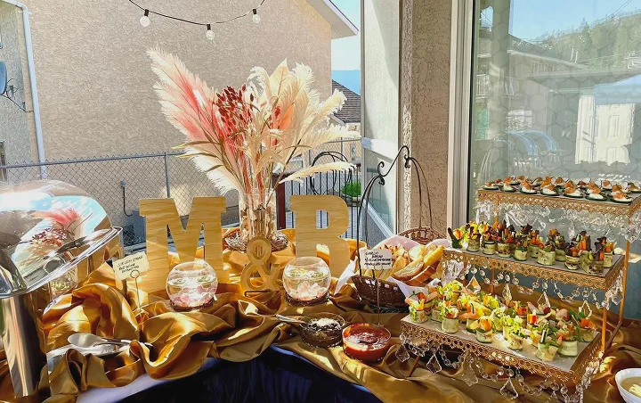 Luxury dessert and catering display with floral accents.