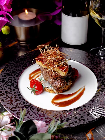 Fine dining plated entrée with artistic presentation.